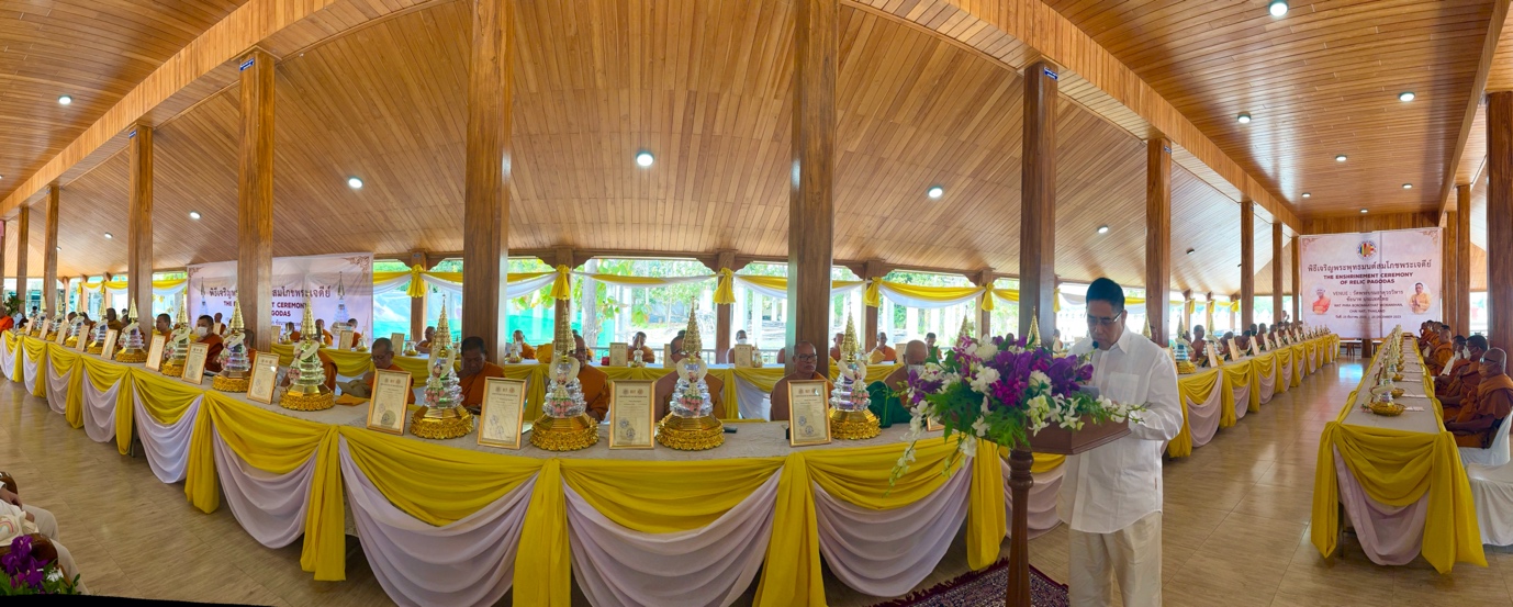 A long table with yellow and white cloth

Description automatically generated