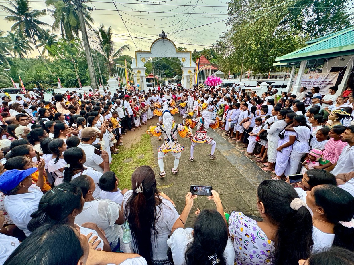 A group of people in white outfitsDescription automatically generated